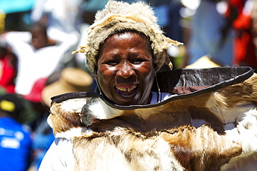 A lady dances and celebrates in traditional costume, Lesotho, Africa