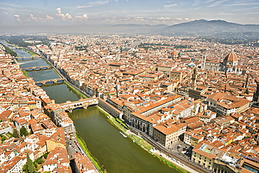 Aerial view of Florence with in the foreground Ponte Vecchio, Palazzo Vecchio and Cattedrale di Santa Maria del Fiore, Florence, Tuscany, Italy, Europe