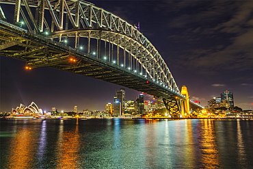 Night cityscape of Sydney, showing the city skyline, the Sydney Harbour Bridge and the Sydney Opera House, Sydney, New South Wales, Australia, Pacific