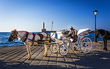 A horse and cart for city tours, at the Venetian era harbour, at the Mediterranean port of Chania (Canea), Crete, Greek Islands, Greece, Europe