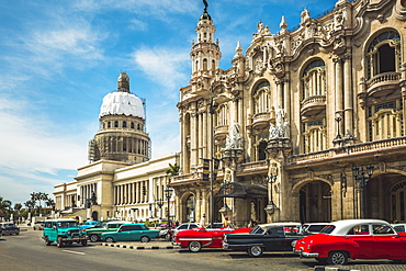 Old American taxi cars parked outside the Gran Teatro de La Habana and El Capitolio, Havana, Cuba, West Indies, Caribbean, Central America