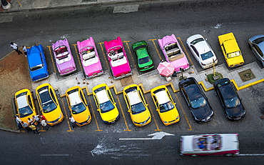 Aerial view of colourful old American taxi cars parked in Havana at dusk, La Habana, Cuba, West Indies, Caribbean, Central America