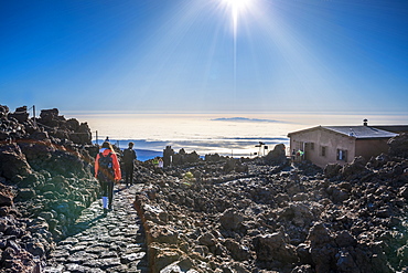 Tourists walking down from top of El Teide volcano to Teide Cable Car in early moning, Tenerife, Canary Islands, Spain, Atlantic, Europe