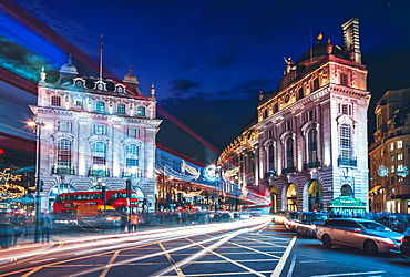 Traffic trails and festive Christmas lights at night, Piccadilly Circus, London, England, United Kingdom, Europe