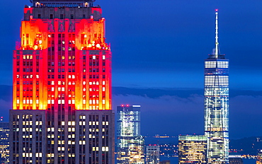 Lower Manhattan skyline from Top of The Rock, Empire State Building at night, New York, United States of America, North America