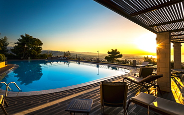 Large swimming pool and sunset over Chania, Crete, Greek Islands, Greece, Europe