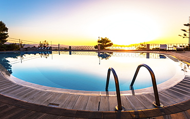 Large swimming pool and sunset over Chania, Crete, Greek Islands, Greece, Europe