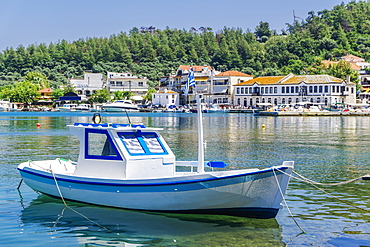 Moored small white boat with Greek flags, Limenas Town, Thassos island, Greek Islands, Greece, Europe