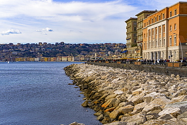 Promenading crowd at Via Partenope waterfront along the Gulf of Napoli, in front of the University Congress Center building, Naples, Campania, Italy, Europe