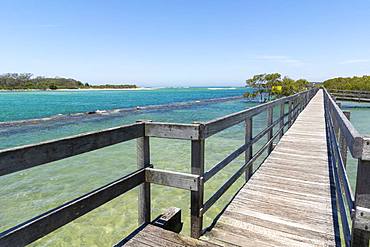 Ocean boardwalk in Urunga on the Coffs Coast stretching along the banks of the Kalang and Bellinger Rivers to the Pacific Ocean, Urunga, New South Wales, Australia, Pacific