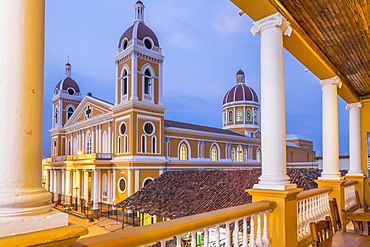 The Cathedral of Granada seen from the balcony of a bar at dusk, Granada, Nicaragua, Central America