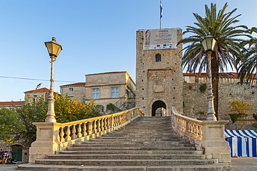 Steps leading up to the entrance gate to the old town of Korcula at first sunlight, Korcula, Croatia, Europe