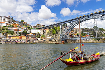 Traditional Rabelo boat on Douro River with view to the Dom Luis I Bridge, Porto, Portugal, Europe