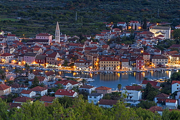 View from the lookout atop Glavica Hill over Stari Grad on Hvar Island at dusk, Hvar, Croatia, Europe