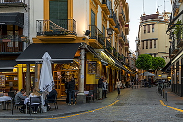 Narrow street in the historical centre at dusk, Seville, Andalusia, Spain, Europe