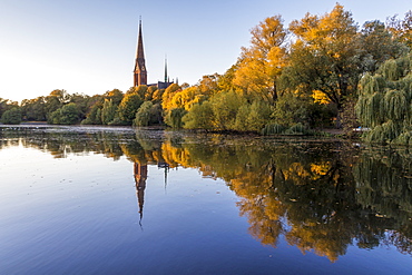 St. Gertrud Church at Kuhmuehlenteich in the Uhlenhorst district during autumn, Hamburg, Germany, Europe