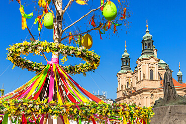 St. Nicholas' Church seen from the Easter Market at the old town market square, UNESCO World Heritage Site, Prague, Bohemia, Czech Republic, Europe