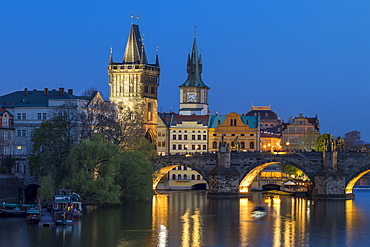 View over Charles Bridge, Old Town Bridge Tower and Vltava River at dusk, UNESCO World Heritage Site, Prague, Bohemia, Czech Republic, Europe