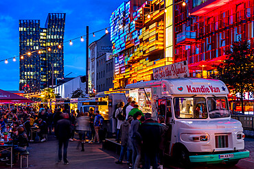 Food truck festival at the Spielbudenplatz near Reeperbahn at dusk, Hamburg, Germany, Europe