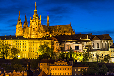 Illuminated Prague Castle and St. Vitus Cathedral seen from the banks of Vltava River, UNESCO World Heritage Site, Prague, Bohemia, Czech Republic, Europe