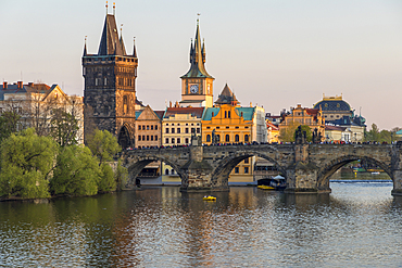 View over Charles Bridge, Old Town Bridge Tower and Vltava River at last sunlight, UNESCO World Heritage Site, Prague, Bohemia, Czech Republic, Europe