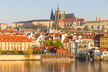 View from the banks of Vltava River over the Mala Strana district, Prague Castle and St. Vitus Cathedral, UNESCO World Heritage Site, Prague, Czech Republic, Europe