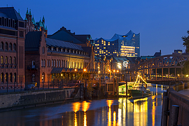 Historical buildings of the Speicherstadt with the Elbphilharmonie building in the background, Hamburg, Germany, Europe