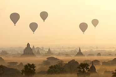 Hot air ballons fly over ancient temples at dawn in Bagan (Pagan), Myanmar (Burma), Asia