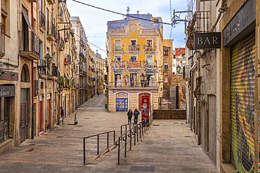 Facade with mural of Carles Arola Vera on Plaça dels Sedassos, Spain, Tarragona, Catalonia, Spain