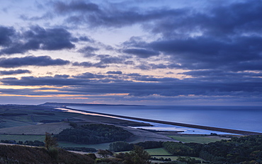 Portland, the sweep of Chesil Beach, the inland lagoon the Fleet seen from the hill at Abbotsbury, near Weymouth, Dorset, England, United Kingdom, Europe