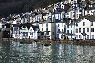 The colourful buildings and their reflections in morning sunshine at Dartmouth, Devon, England, United Kingdom, Europe