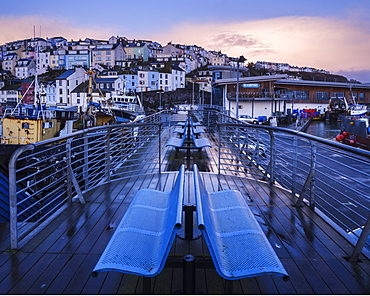 Wet teak decking and benches of the elevated nautical viewpoint for the harbour of Brixham, Devon, England, United Kingdom, Europe