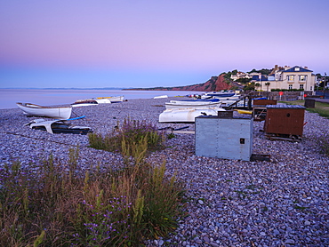 A lilac twilight with boats on the pebbled beach at Budleigh Salterton, Devon, England, United Kingdom, Europe