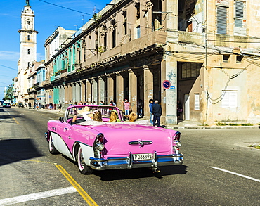 A vintage American car in a typical street in Havana, Cuba, West Indies, Caribbean, Central America