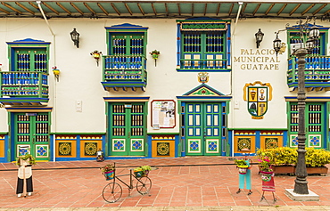 The colourful facade of the Palacio Municipal (City hall and tourist office), in the picturesque town of Guatape, Colombia, South America