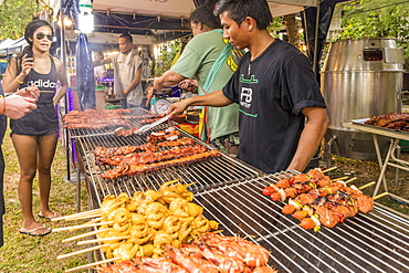 A food stall selling grilled meat in the night market in Kamala in Phuket, Thailand, Southeast Asia, Asia