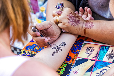 A henna tattoo being applied at the famous Walking Street night market in Phuket old Town, Phuket, Thailand, Southeast Asia, Asia