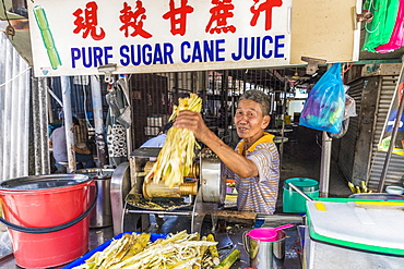 A pure sugar cane juice stall in George Town, Penang Island, Malaysia, Southeast Asia, Asia.