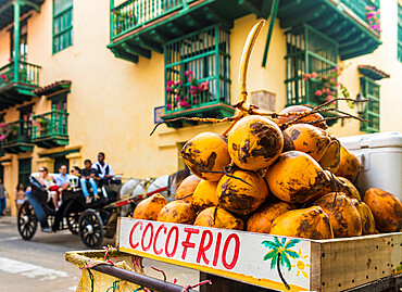 A street stall selling coconuts in the old town, Cartagena de Indias, Colombia, South America