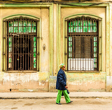 A local man passing a beautifully aged building, Havana, Cuba, West Indies, Caribbean, Central America