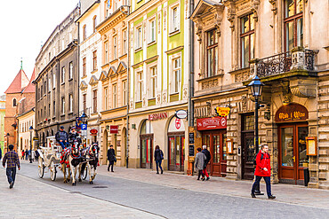 A horse drawn carriage in the medieval old town, UNESCO World Heritage Site, Krakow, Poland, Europe