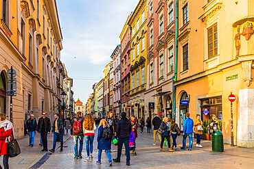 A street scene in the medieval old town, UNESCO World Heritage Site, Krakow, Poland, Europe