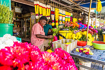 Colourful traditional garland maker in George Town, UNESCO World Heritage Site, Penang Island, Malaysia, Southeast Asia, Asia