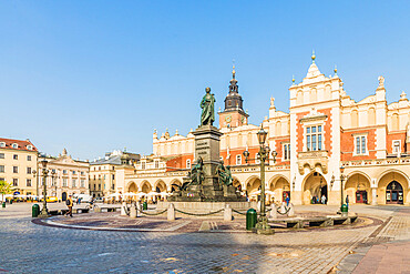 Adam Mickiewicz Monument and Cloth Hall in the main Square in the medieval old town, UNESCO World Heritage Site, Krakow, Poland, Europe