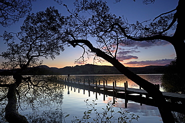 Sunset at Rigg Wood jetty on Coniston Water, Lake District National Park, UNESCO World Heritage Site, Cumbria, England, United Kingdom, Europe