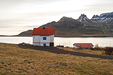 Traditional Icelandic house in Stodvarfjordur by the Fjords in East Iceland, Iceland, Polar Regions