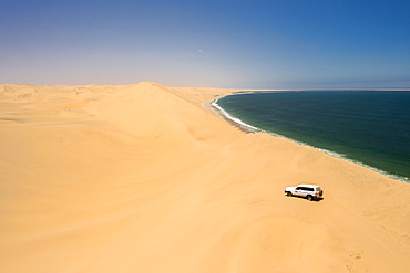 Drone shot of car in Sandwich Harbour, Namibia, Africa