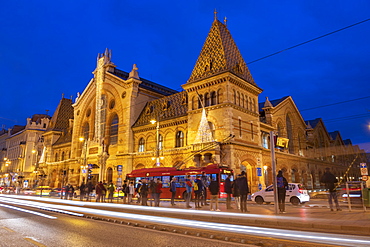 Exterior of Great Market Hall (Central Market Hall) at night with light trails, Kozponti Vasarcsarnok, Budapest, Hungary, Europe