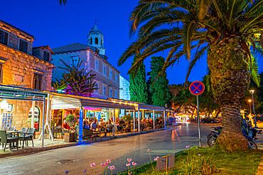 View of restaurants and church at dusk, Cavtat on the Adriatic Sea, Cavtat, Dubrovnik Riviera, Croatia, Europe