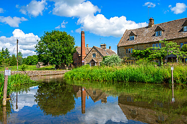 Mill and cottages on River Eye, Lower Slaughter, Cotswolds, Gloucestershire, England, United Kingdom, Europe